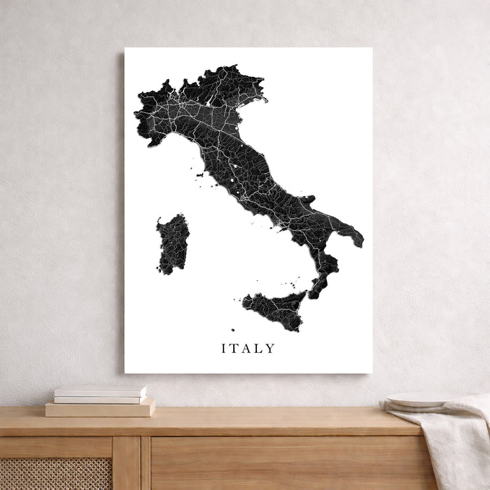 Map of Italy on a white background above a wooden surface.