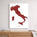 Map of Italy on a white background, framed and leaning against a light gray wall.