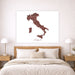 Map of Italy on a wall above a bed in a bedroom setting