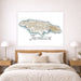 Map of Jamaica on a wall above a bed in a bedroom setting