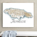 Framed map of Jamaica on a wall above a white bench.