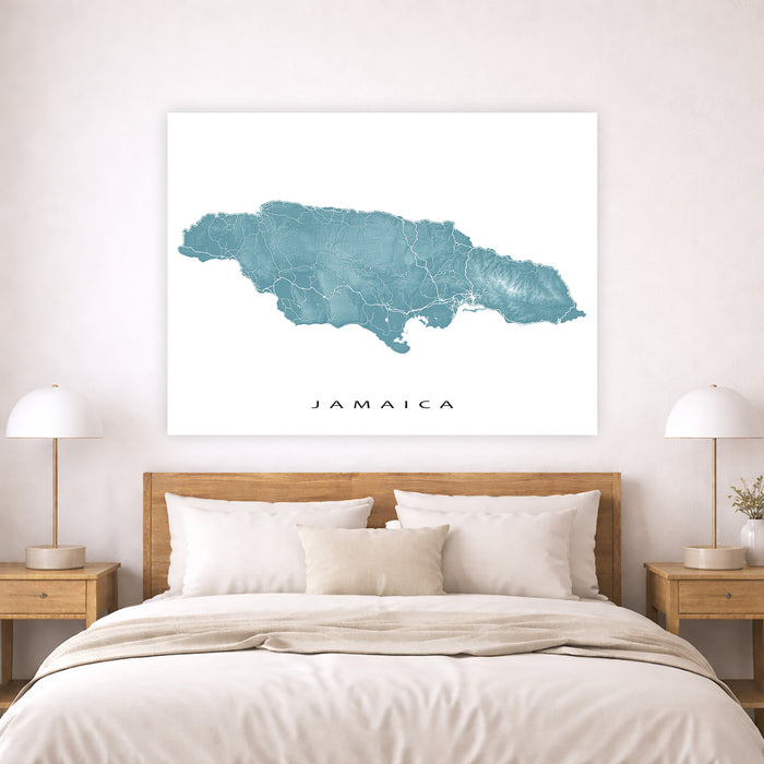 Map of Jamaica on a wall above a bed in a bedroom