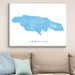 Framed map of Jamaica on a wall above a beige sofa with light blue cushions.