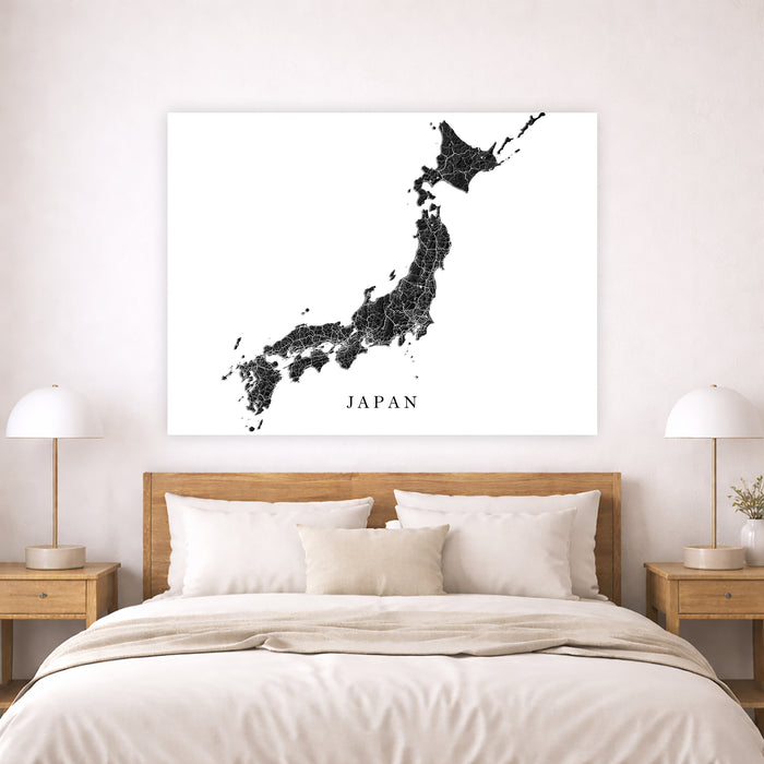 Map of Japan on a wall above a bed in a bedroom setting