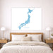 Map of Japan on a wall above a bed in a bedroom setting