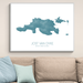 Framed map of Jost Van Dyke on a wall above a beige sofa with light blue pillows.