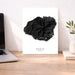 Black coral art print on a white background with 'Kauai Hawaii' text, placed on a wooden desk.