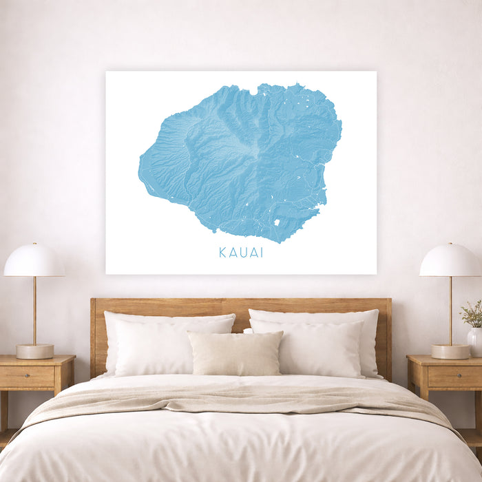 Bedroom with a map of Kauai on the wall above a bed.