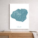 Unframed map of Kauai on a wall above a wooden shelf.