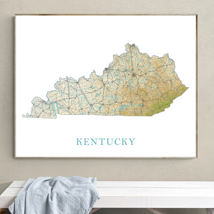 Framed map of Kentucky on a wall above a white surface with a gray towel.