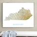 Framed map of Kentucky on a wall above a white surface with a gray towel.