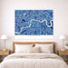 Map of London on a wall above a bed in a bedroom setting