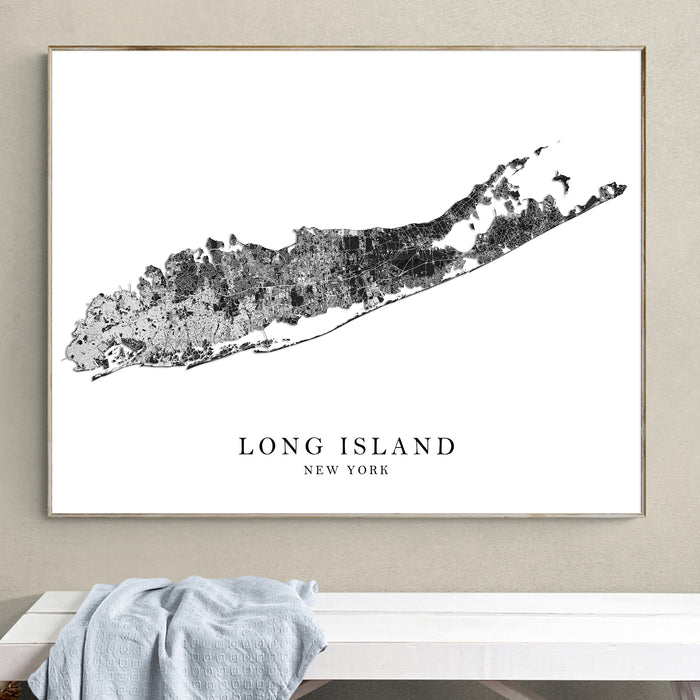Framed map of Long Island, New York on a wall above a bench.