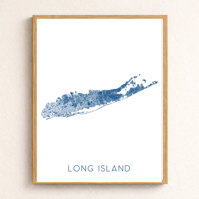 Framed map of Long Island with a wooden frame on a beige wall.