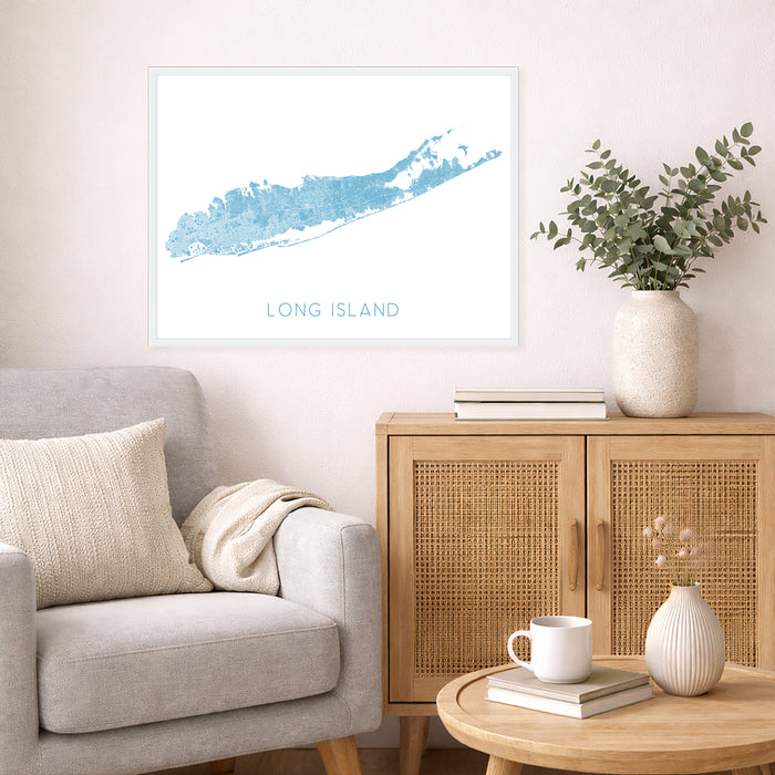 Living room with a gray sofa, wooden cabinet, and a framed map of Long Island on the wall.