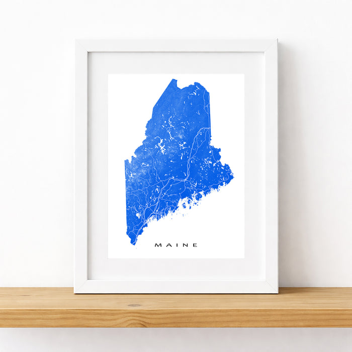 Framed map of Maine with a blue outline on a white background