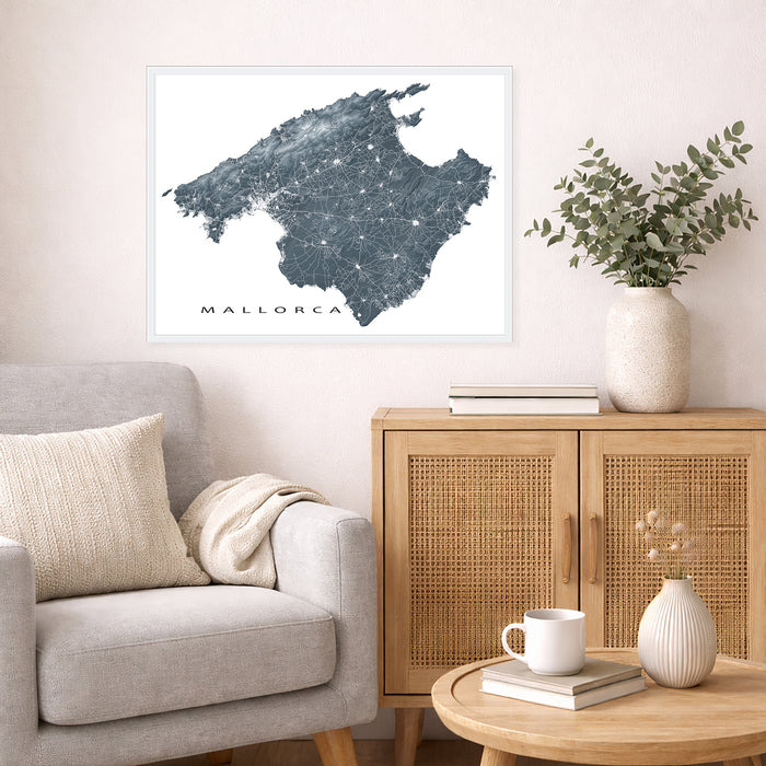 Framed map of Mallorca above a sofa in a living room setting.