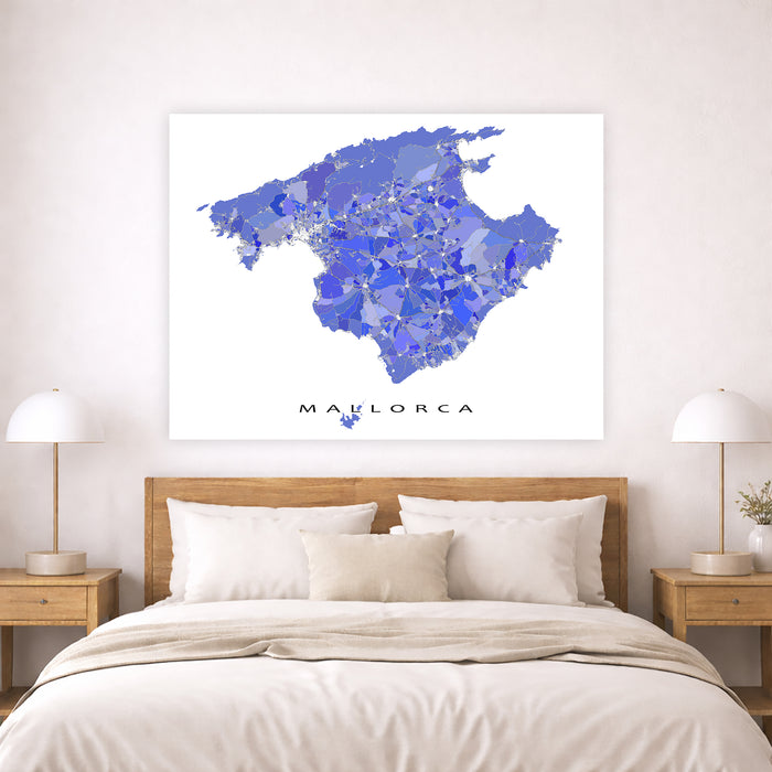 Map of Mallorca on a wall above a bed in a bedroom
