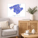 Living room with a map of Mallorca on the wall, a couch, and a wooden cabinet.