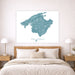 Map of Mallorca on a wall above a bed in a bedroom