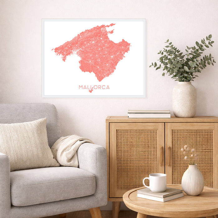 Living room with a gray sofa, wooden cabinet, and a framed map of Mallorca on the wall.