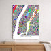 Colorful map of Manhattan on a wall above a wooden shelf.