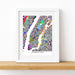 Framed colorful map of Manhattan on a white wall