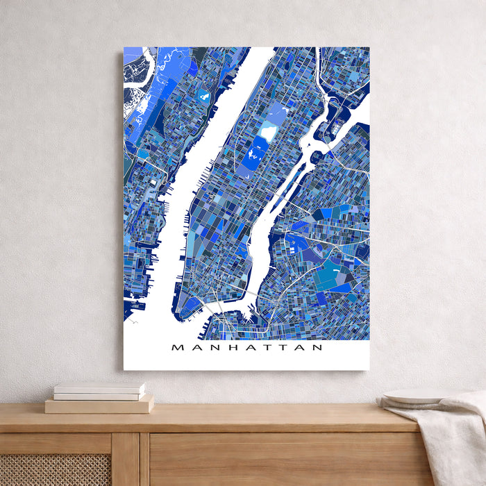 Map of Manhattan in blue and white on a wall above a wooden shelf.