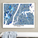 Framed map of Manhattan, New York on a wall above a white bench.