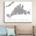 Framed map of Martha's Vineyard on a wall above a beige sofa with blue pillows.
