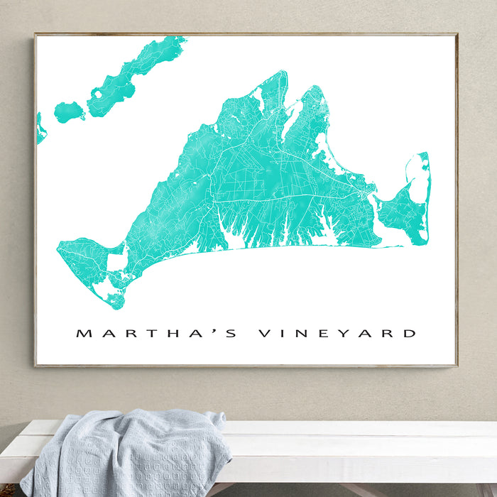 Framed map of Martha's Vineyard on a wall above a bench.