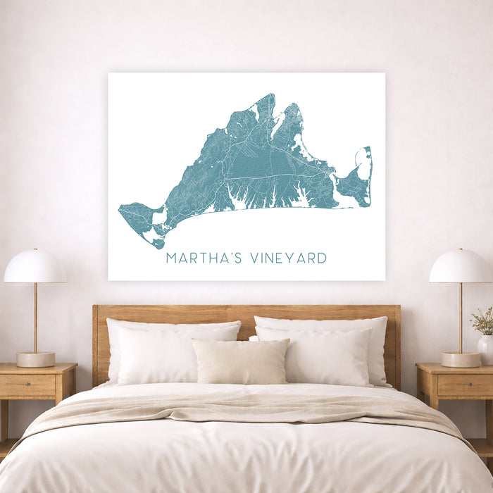 Bedroom with a map of Martha's Vineyard on the wall above a bed.