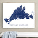 Framed map of Martha's Vineyard on a wall above a bench.
