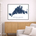 Framed map of Martha's Vineyard on a wall above a wooden cabinet and sofa.