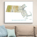 Map of Massachusetts framed on a wall above a sofa