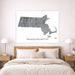Map of Massachusetts on a wall above a bed in a bedroom setting