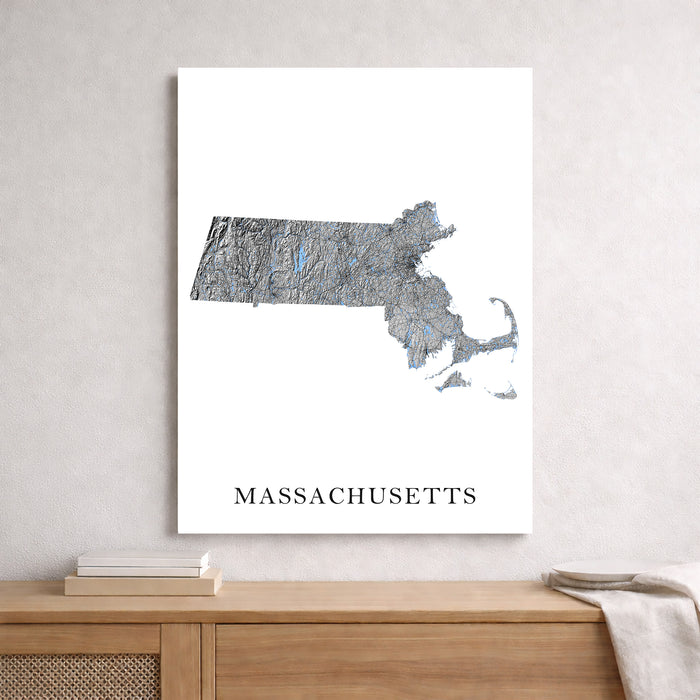 Map of Massachusetts on a white background above a wooden surface.