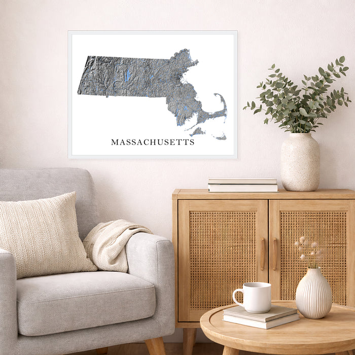 Framed map of Massachusetts on a wall above a sofa and sideboard in a living room.