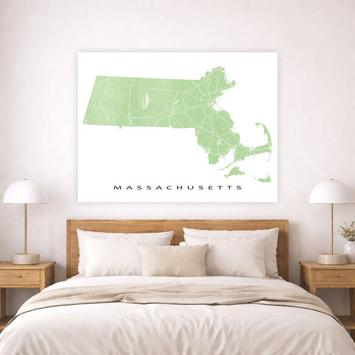 Map of Massachusetts on a wall above a bed in a bedroom