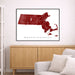 Map of Massachusetts framed on a wall above a wooden cabinet and gray sofa.