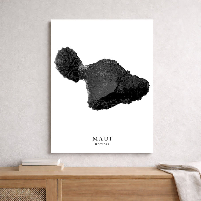 Map of Maui, Hawaii on a white background above a wooden surface.