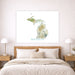 Map of Michigan on a wall above a bed in a bedroom setting