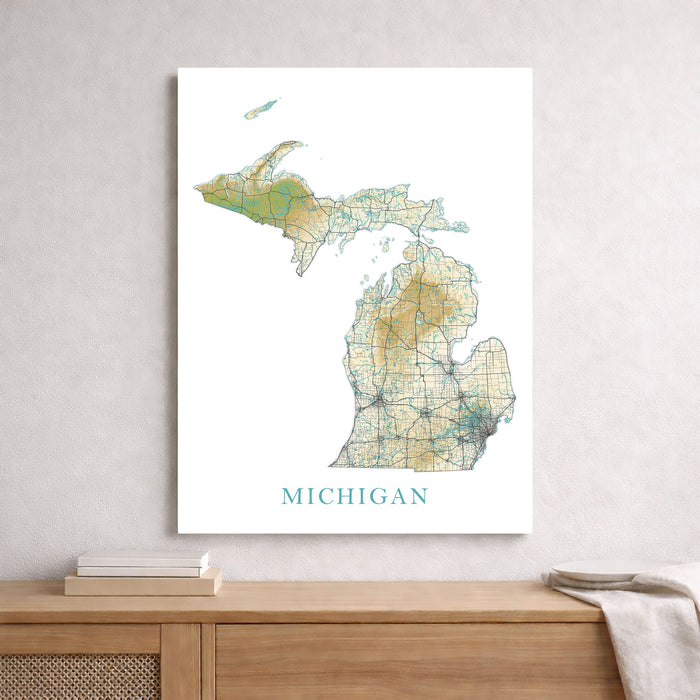 Map of Michigan on a white wall above a wooden surface