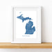 Framed map of Michigan on a white wall