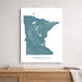 Map of Minnesota on a white wall above a wooden surface