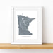 Framed map of Minnesota on a white wall