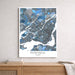 Framed map of Montreal, Quebec on a wall above a wooden surface.