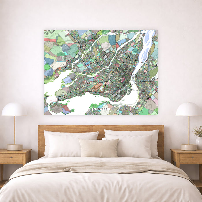 Colorful map of Montreal on a wall above a bed in a bedroom.
