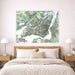 Colorful map of Montreal on a wall above a bed in a bedroom.