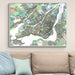Colorful map of Montreal on a wall above a beige sofa with light blue pillows.